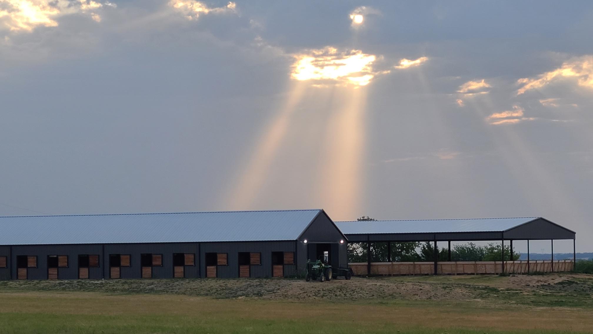 Lucky Star Farm barn with rainbow over Celina Texas